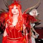 Yaya stands at attention as the Fire Fairy, as the other cosplayers peek, glare or smirk.